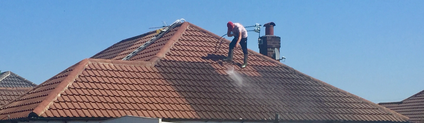 Pressure cleaning a roof in Macclesfield.